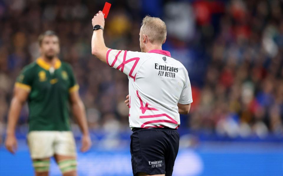 Wayne Barnes shows a red card to Sam Cane