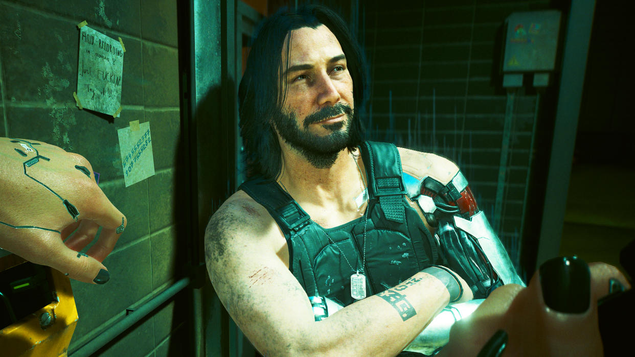  Cyberpunk 2077 character Johnny Silverhand with arms crossed looks away from the camera and smiles. 
