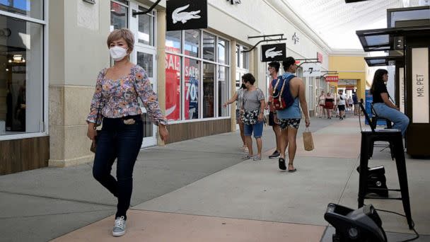 PHOTO: People walk through the Orlando Vineland Premium Outlets shopping mall on July 12, 2022, in Orlando, Fla. (Phelan M. Ebenhack via AP)