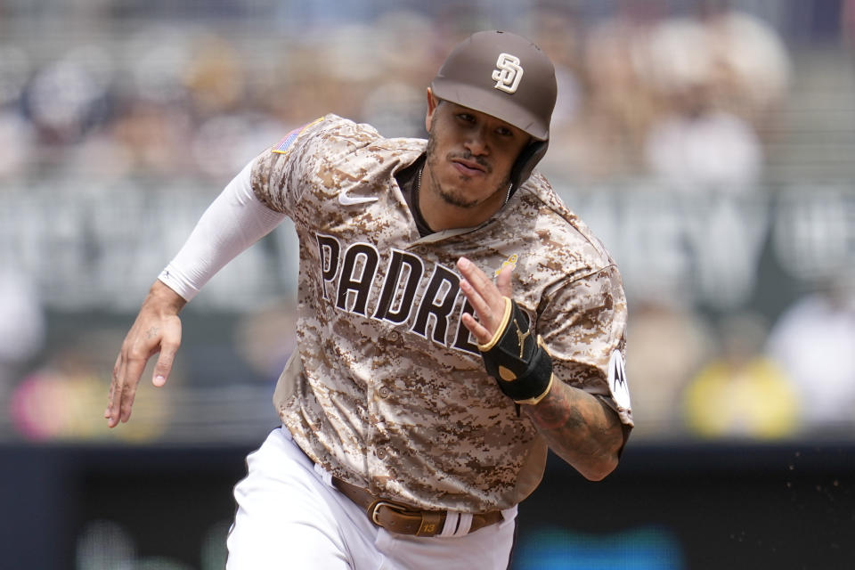 San Diego Padres' Manny Machado rounds second base on his way to scoring from first off an RBI double by Xander Bogaerts during the first inning of a baseball game against the San Francisco Giants, Sunday, Sept. 3, 2023, in San Diego. (AP Photo/Gregory Bull)