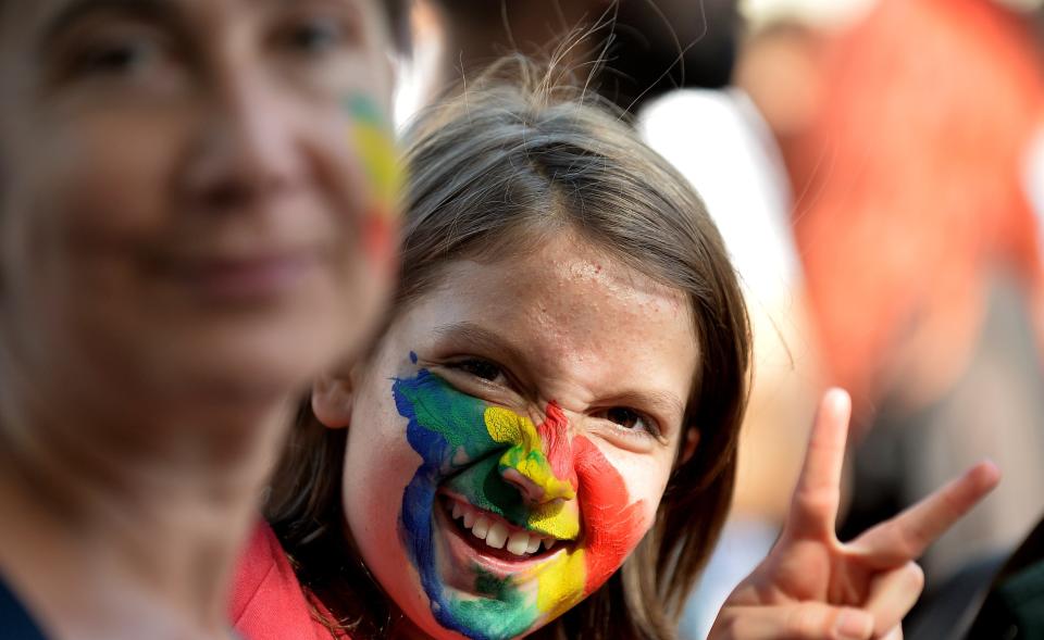 A young girl sporting rainbow colours takes part in the annual Gay Pride parade in Rome on June 7, 2014. (TIZIANA FABI/AFP/Getty Images)