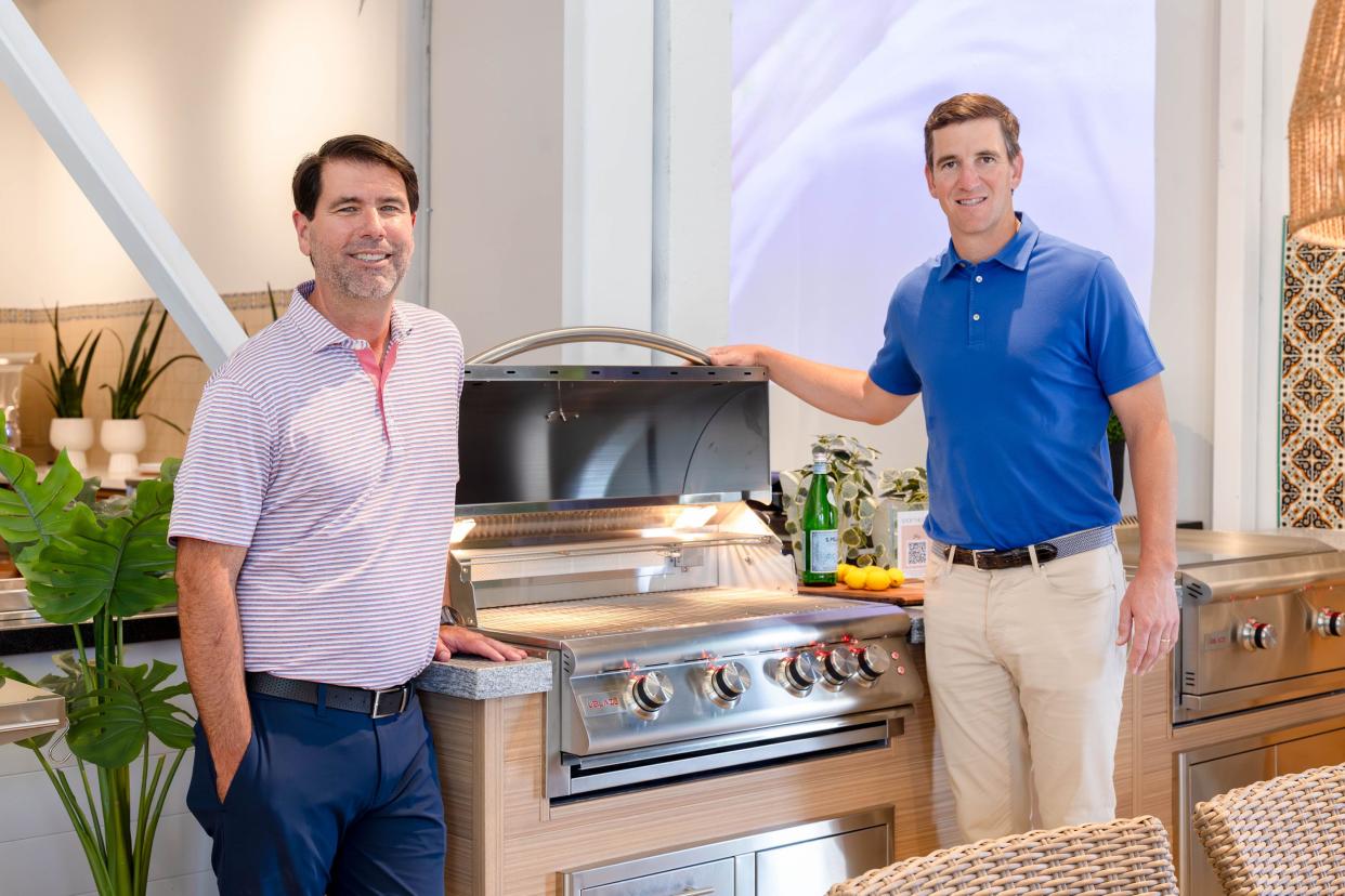 BBQGuys' CEO Russ Wheeler and Eli Manning highlight product at new Backyard Design Center in West Palm Beach, May 9, 2024.