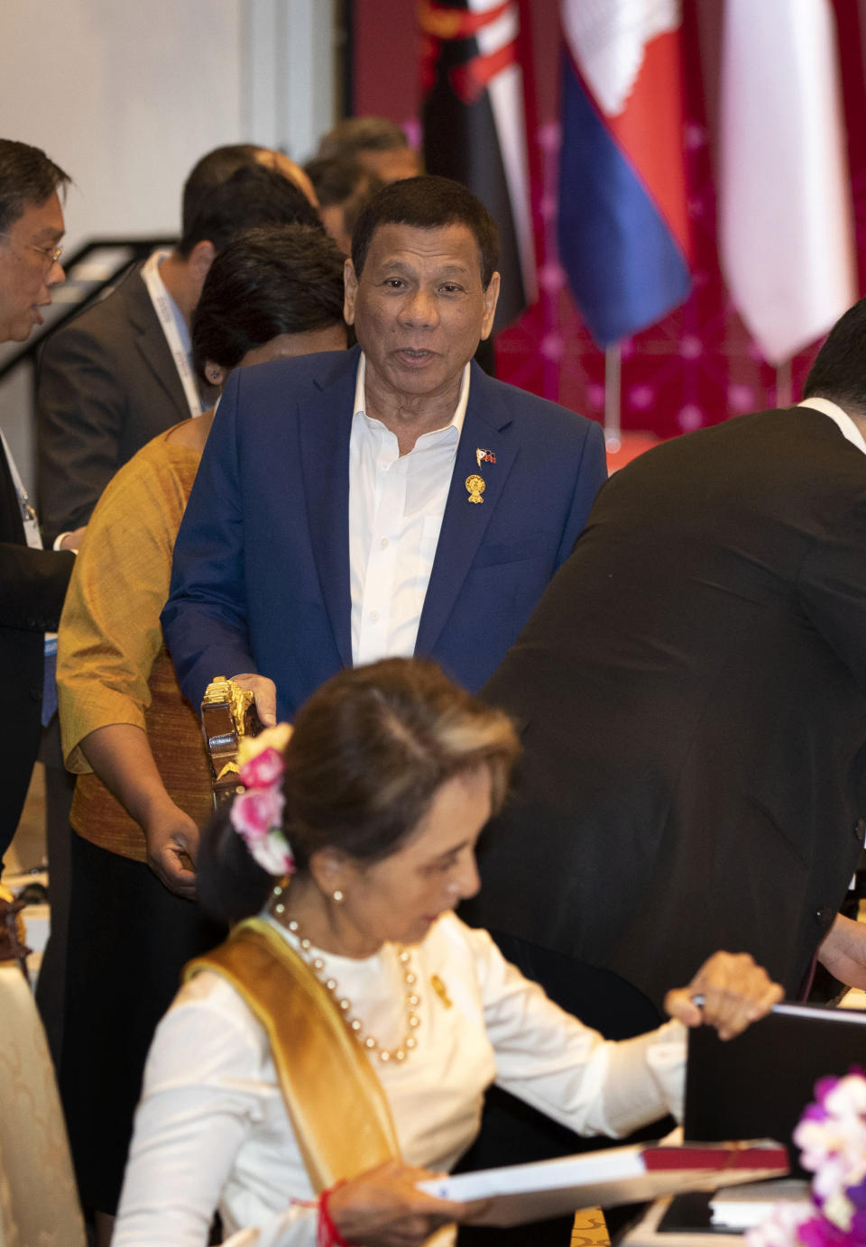 Philippines' President Rodrigo Duterte walks in to participate in the Association of Southeast Asian Nations (ASEAN) leaders summit plenary session in Bangkok, Thailand, Saturday, June 22, 2019. (AP Photo/Gemunu Amarasinghe)