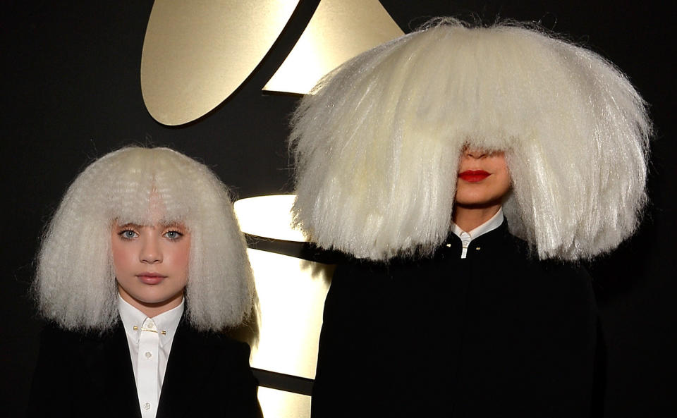 Dancer Maddie Ziegler (L) and singer/songwriter Sia attend The 57th Annual GRAMMY Awards in 2015. (Photo: Lester Cohen via Getty Images)