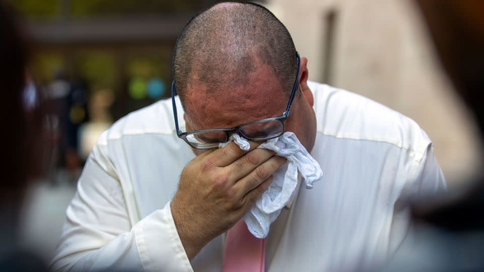 Paul Jamrowski, father of Jordan Anchondo and father in-law of Andre Anchondo, who both died in the 2019 mass shooting, breaks down in tears while speaking to the media outside the federal courthouse in El Paso, Texas on Wednesday.   - Andrés Leighton/AP