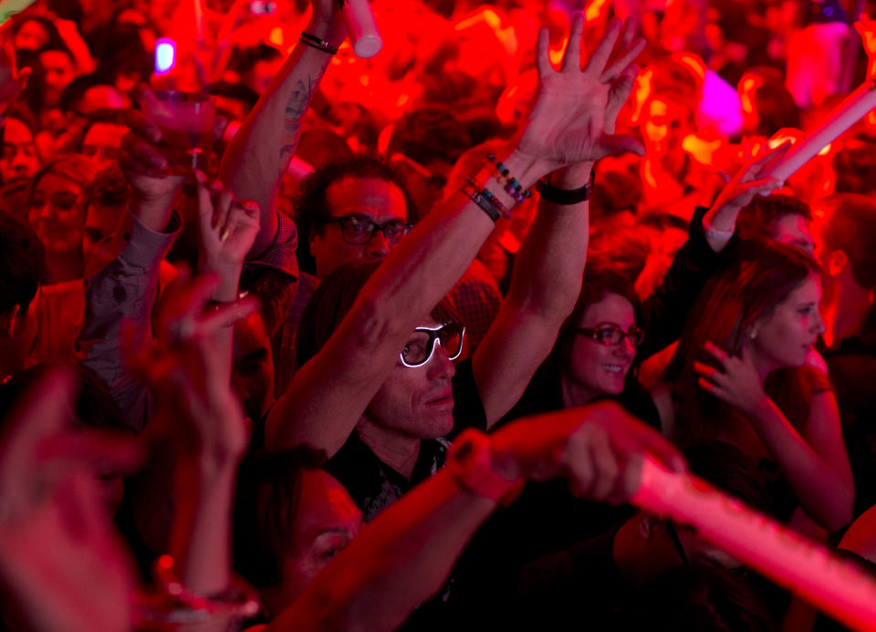 Revelers dance to the music of DJ Cedric Gervais at the Surrender nightclub in Las Vegas on Sunday, Jan. 20, 2013. (AP Photo/Julie Jacobson)