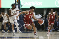 Oklahoma forward Jalen Hill (1) drives up court ahead of West Virginia guard Taz Sherman (12) during the first half of an NCAA college basketball game in Morgantown, W.Va., Wednesday, Jan. 26, 2022. (AP Photo/Kathleen Batten)