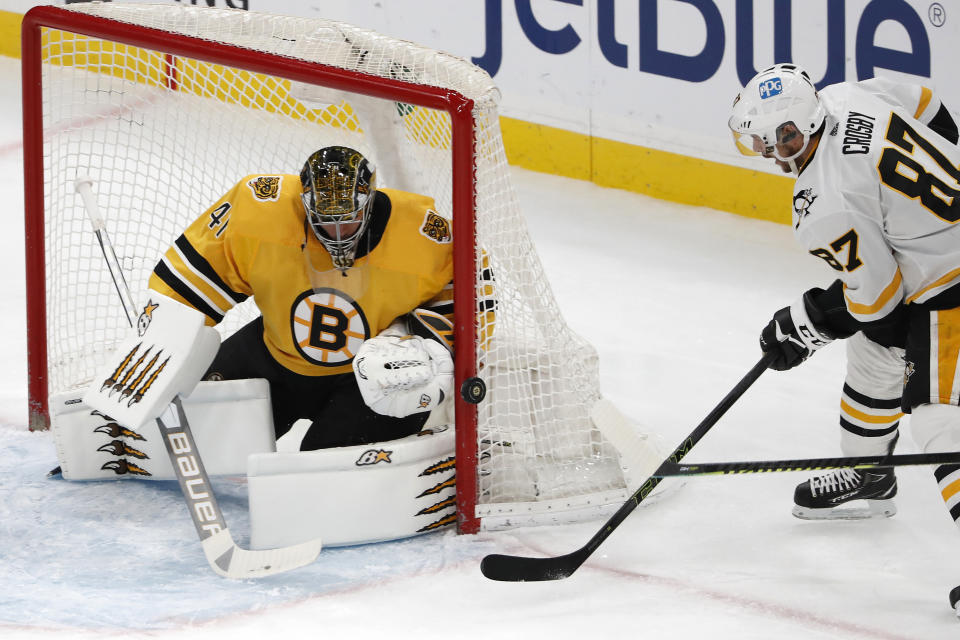 Pittsburgh Penguins' Sidney Crosby can't get the puck past Boston Bruins goaltender Jaroslav Halak during the second period of an NHL hockey game Saturday, April 3, 2021, in Boston. (AP Photo/Winslow Townson)