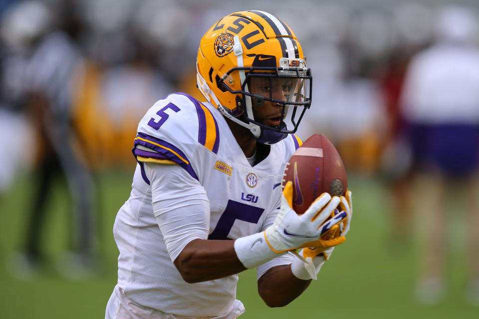 Koy Moore catches a football.