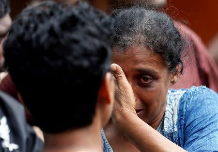 A relative of a victim reacts at a landslide site during a rescue mission in Athwelthota village, in Kalutara, Sri Lanka May 28, 2017. REUTERS/Dinuka Liyanawatte