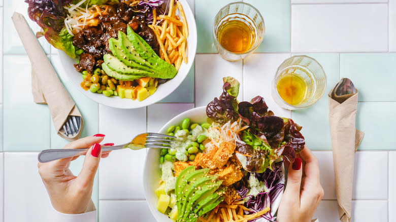 bowls of salad with glasses of tea