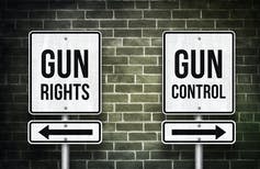 Sign that says 'gun rights' with an arrow pointing one way and sign that says 'gun control' with the arrow pointing in the opposite direction.