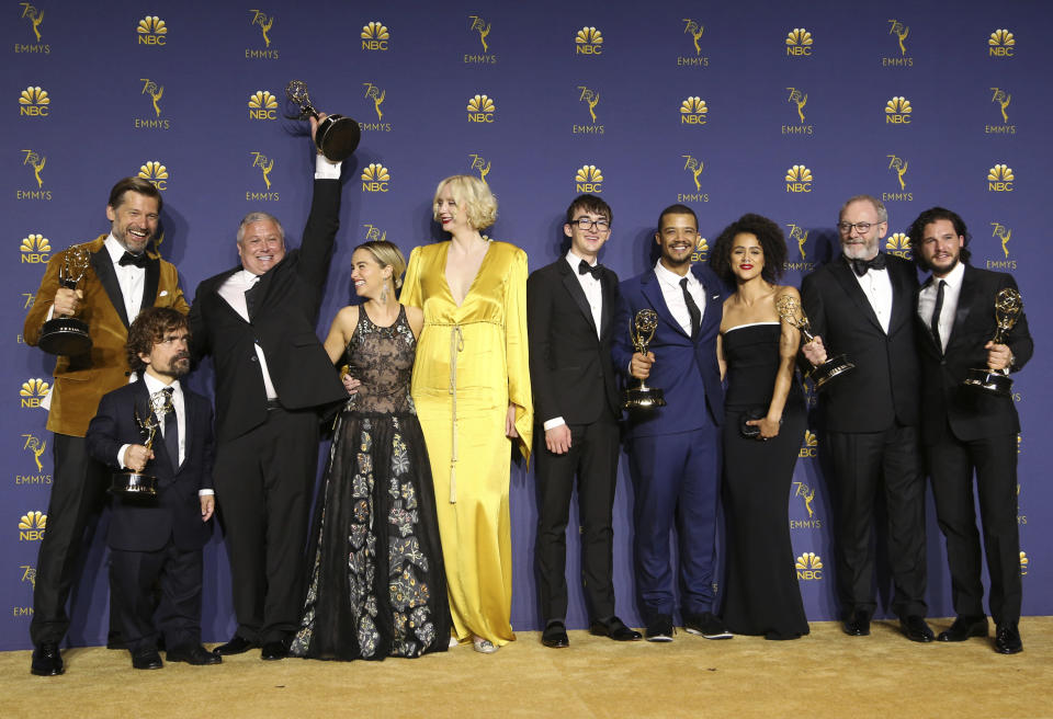 Nikolaj Coster-Waldau, from left, Peter Dinklage, Conleth Hill, Emilia Clarke, Gwendoline Christie, Isaac Hempstead Wright, Jacob Anderson, Nathalie Emmanuel, Liam Cunningham, and Kit Harington pose in the press room with the award for outstanding drama series for "Game of Thrones" at the 70th Primetime Emmy Awards on Monday, Sept. 17, 2018, at the Microsoft Theater in Los Angeles. (Photo by Willy Sanjuan/Invision for the Television Academy/AP Images)