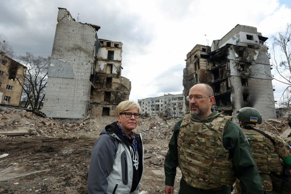 Lithuanian Prime Minister Ingrida Simonyte and Ukrainian counterpart Denys Shmyhal visit the town of Borodianka in Ukraine's Kyiv region in April 2022.