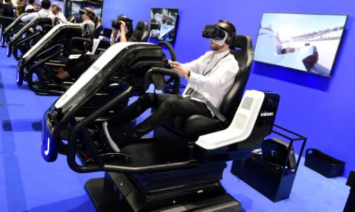 Visitors test virtual reality glasses at the 2018 IFA trade show in Berlin