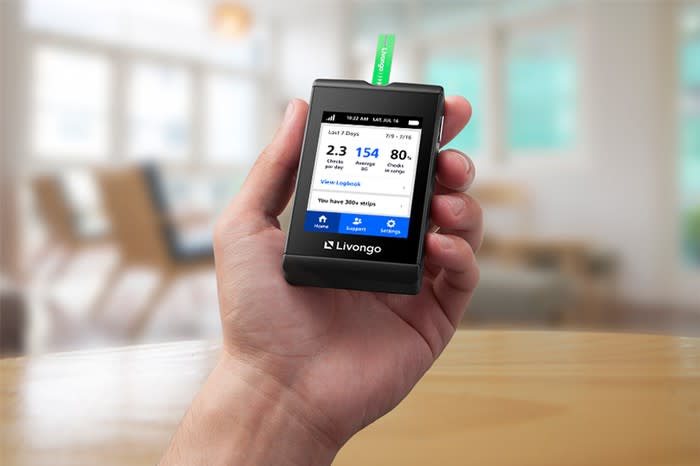 Hand with Livongo blood glucose meter in it