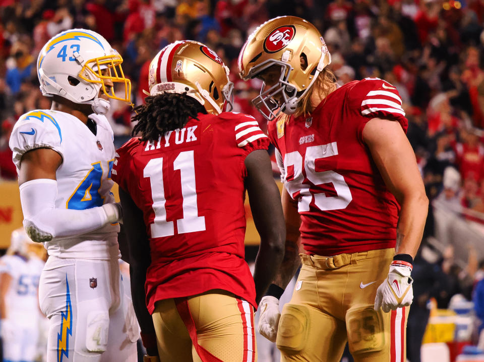 Nov 13, 2022; Santa Clara, California, USA; San Francisco 49ers wide receiver Brandon Aiyuk (11) celebrates with tight end George Kittle (85) after a play against the Los Angeles Chargers during the fourth quarter at Levi's Stadium. Mandatory Credit: Kelley L Cox-USA TODAY Sports