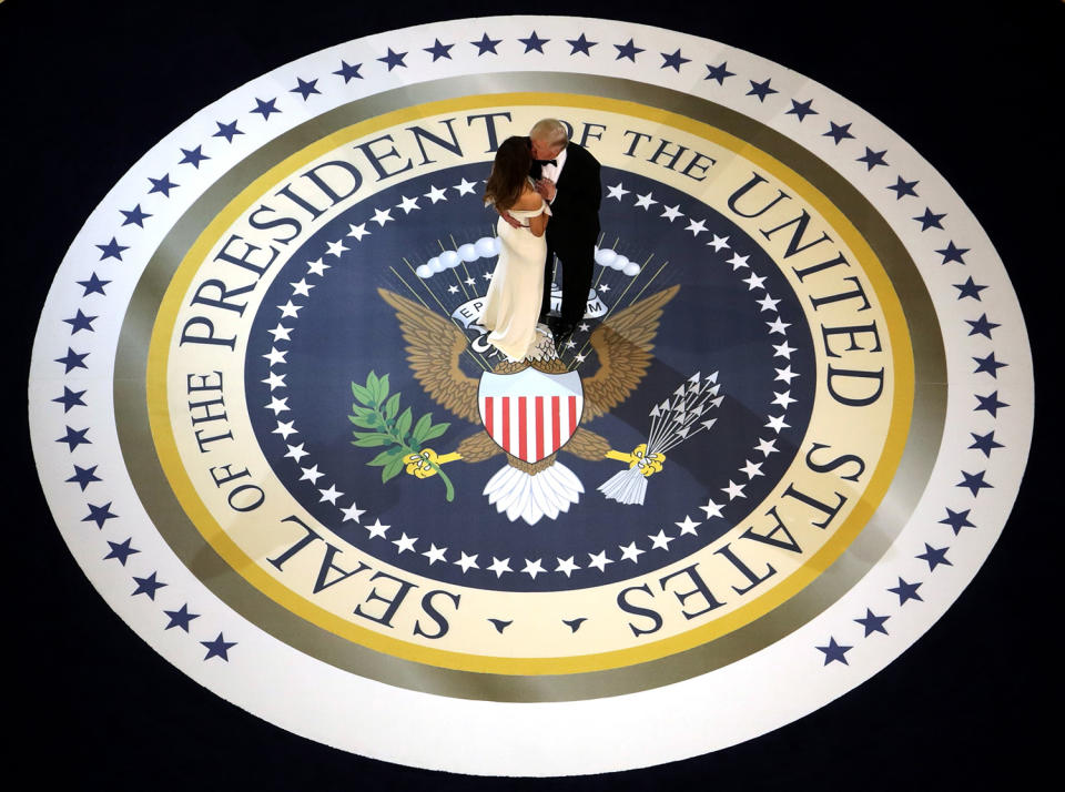 <p>President Donald Trump and his wife First Lady Melania Trump kiss and dance on stage during A Salute To Our Armed Services Inaugural Ball at the National Building Museum on January 20, 2017 in Washington, D.C. (Alex Wong/Getty Images) </p>