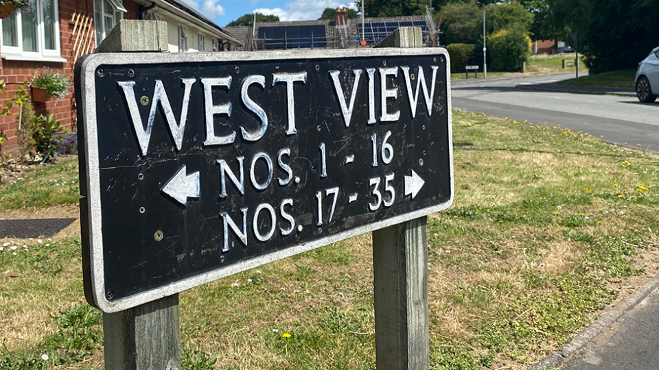 West View in Ford, near Shrewsbury, showing a sign and houses in the background