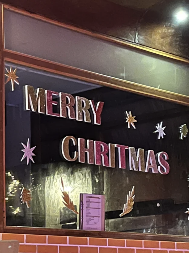 Sign that reads, "MERRY CHRITMAS"