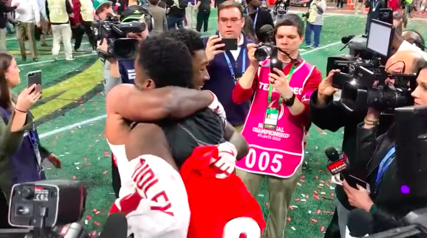 Brothers Riley Ridley, of Georgia, and Calvin Ridley, of Alabama, embrace after the College Football Playoff National Championship.