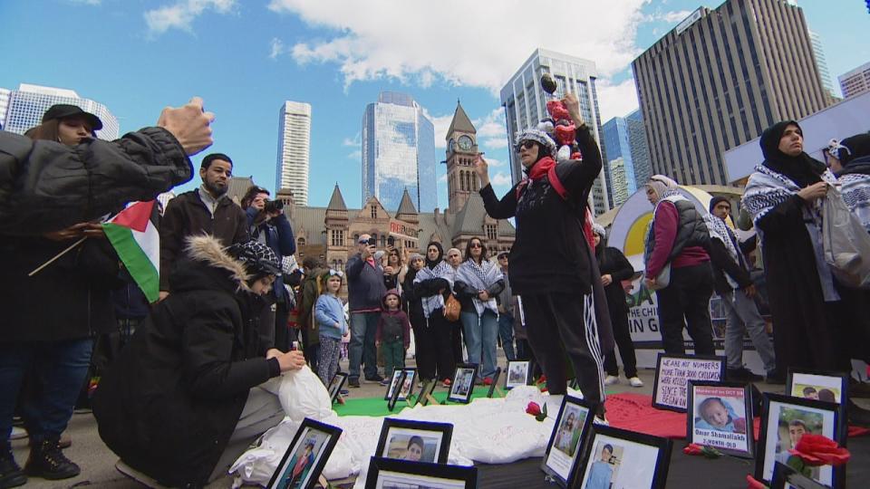 People rallied in Toronto Saturday, joining hundreds of thousands of demonstrators around the world who gathered to support Palestinians. (Petar Valkov/CBC - image credit)