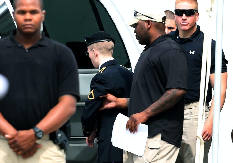 Chelsea Manning, in uniform, after being sentenced on Aug. 21, 2013, to 35 years in prison after being found guilty of several counts under the Espionage Act. <a href="https://www.gettyimages.com/detail/news-photo/army-private-first-class-bradley-manning-is-escorted-by-news-photo/177149744?adppopup=true" rel="nofollow noopener" target="_blank" data-ylk="slk:Photo by Mark Wilson/Getty Images;elm:context_link;itc:0;sec:content-canvas" class="link ">Photo by Mark Wilson/Getty Images</a>