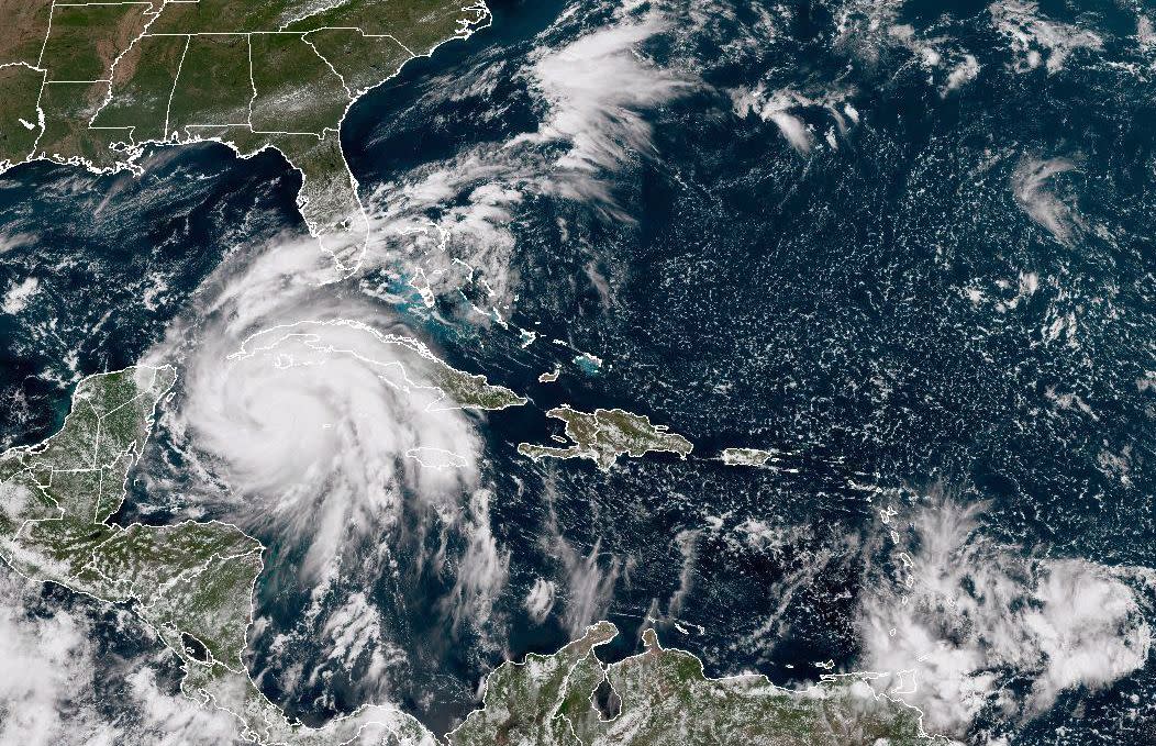 In this NOAA handout image taken by the GOES satellite at 17:30 UTC shows Hurricane Ian as it moves toward western Cuba on September 26, 2022 in the Caribbean Sea. 