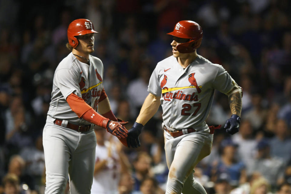 St. Louis Cardinals' Tyler O'Neill (27) celebrates with teammate Nolan Gorman, left, after hitting a two-run home run during the fourth inning of the second game of a baseball doubleheader against the Chicago Cubs Tuesday, Aug. 23, 2022, in Chicago. (AP Photo/Paul Beaty)