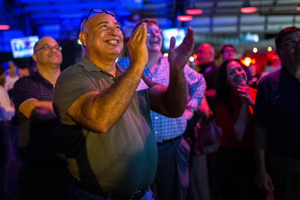 Andrew DuArté, an election official at Oveal Williams Senior Center, cheers after a local television station announced a victory for Nueces County Judge-elect Connie Scott at a Republican watch party at Brewster Street Icehouse in Corpus Christi, Texas on Election Day, Tuesday, Nov. 8, 2022.