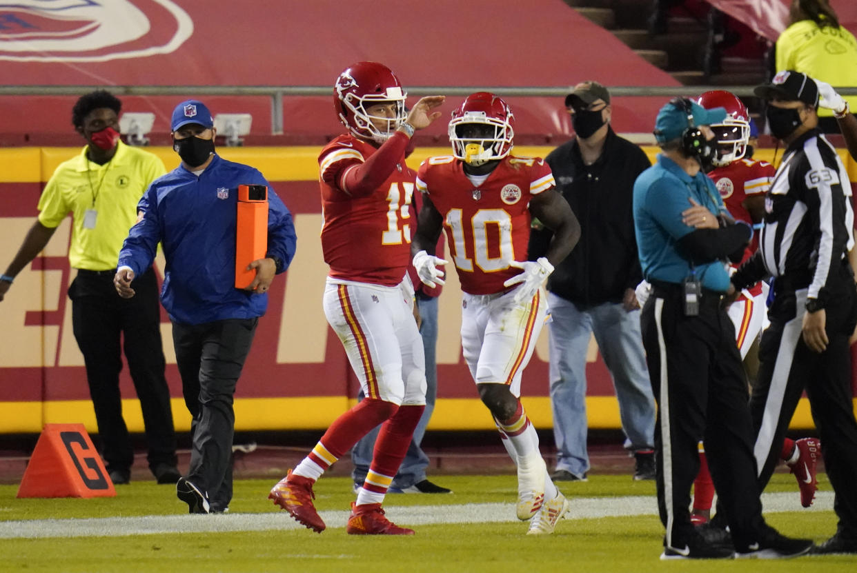 Kansas City Chiefs wide receiver Tyreek Hill (10) celebrates with teammate Patrick Mahomes (15) 