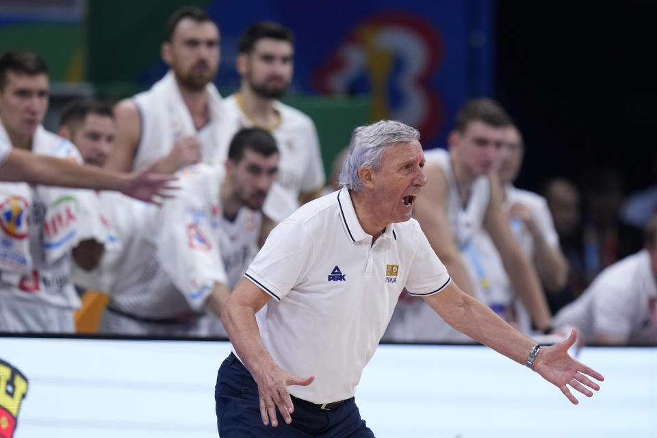 Serbia head coach Svetislav Pesic yells from the sidelines during a Basketball World Cup semi final game against Canada in Manila, Philippines, Friday, Sept. 8, 2023. (AP Photo/Michael Conroy)