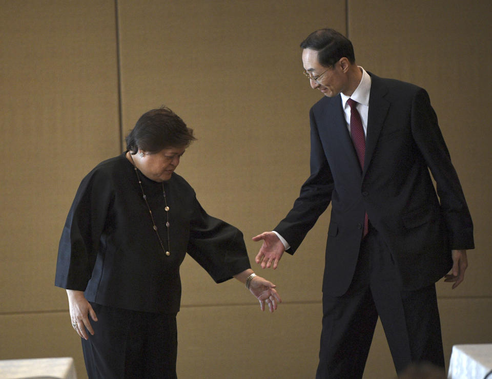 Theresa Lazaro, left, Philippines' Undersecretary for Bilateral Relations and Asian Affairs of the Department of Foreign Affairs, gestures to Sun Weidong, China's Vice Foreign Minister, prior to the start of the Philippines-China Foreign Ministry consultation meeting at a hotel in Manila on Thursday March 23, 2023.(Ted Aljibe/Pool via AP)