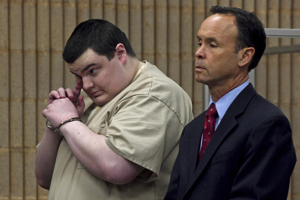 Peter Manfredonia stands during his sentencing hearing in Milford Superior Court, in Milford, Conn. Wednesday, April 19, 2023. Manfredonia was sentenced to 55 years in prison for the 2020 murder of his former high school classmate, Nicholas Eisele, in Derby and the kidnapping of Eisele's girlfriend Shannon Spies. Manfredonia is seen here with his defense attorney Michael Dolan. (Ned Gerard/Hearst Connecticut Media via AP)/Hearst Connecticut Media via AP, Pool)