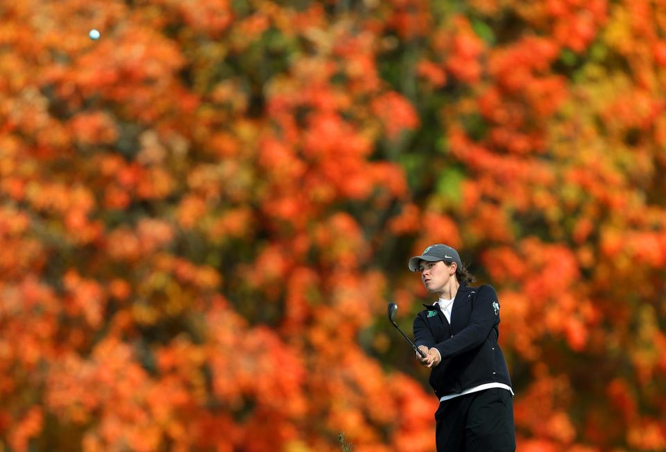 Highland's Isabella Goyette watches her shot onto the 8th hole during the Division I girls district golf tournament at Brookledge Golf Club, Thursday, Oct. 13, 2022, in Cuyahoga Falls, Ohio.