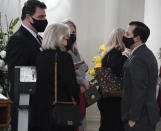 Patti Miller speaks with Senate President Bill Ferguson as her husband, Senate President Emeritus Thomas V. Mike Miller, lies in state under the State House dome in Annapolis, Md., Thursday, Jan. 21, 2021. (Kim Hairston/The Baltimore Sun via AP, Pool)