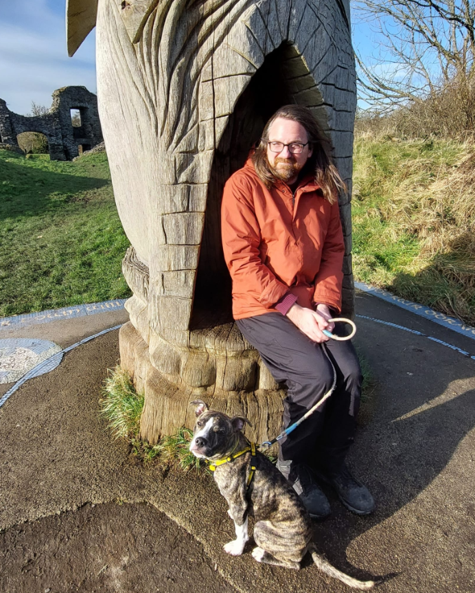 Man sitting with dog