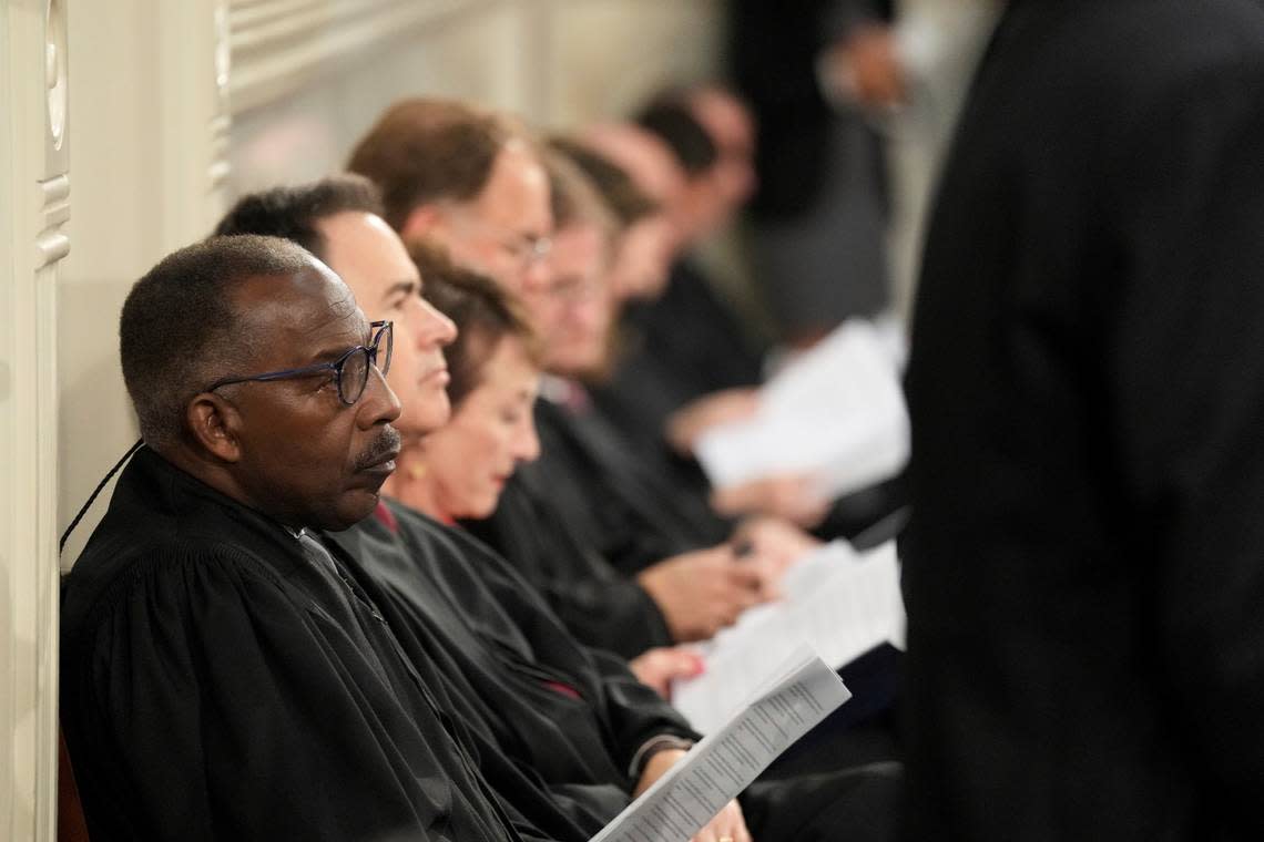 South Carolina Supreme Court Chief Justice Don Beatty, left, sits with other justices during Gov. Henry McMaster’s State of the State address on Wednesday, Jan. 25, 2023, in Columbia, S.C. (AP Photo/Meg Kinnard)
