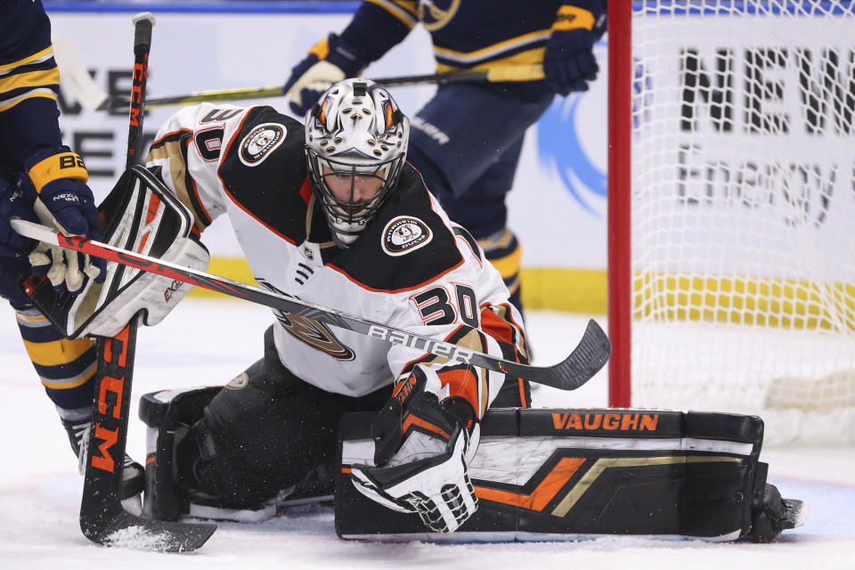 Anaheim Ducks goalie Ryan Miller (30) makes a glove save during the third period of an NHL hockey game against the Buffalo Sabres, Sunday, Feb. 9, 2020, in Buffalo, N.Y. (AP Photo/Jeffrey T. Barnes)