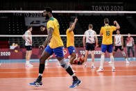 Brazil's Isac Santos celebrates a point during a men's volleyball preliminary round pool B match between Brazil and United States at the 2020 Summer Olympics, Friday, July 30, 2021, in Tokyo, Japan. (AP Photo/Manu Fernandez)