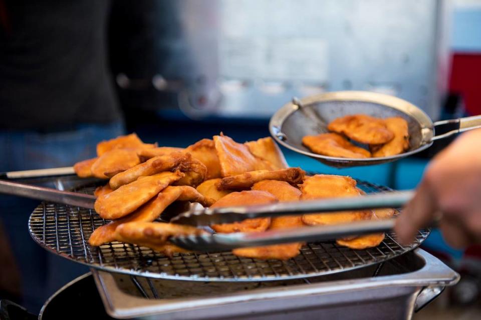 Fried sweet potatoes are prepared during the annual Livingston Sweet Potato Festival at the Max Foster Sports Complex in Livingston, Calif.