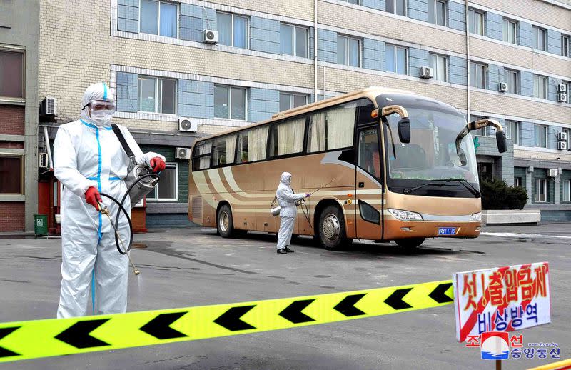 KCNA picture of volunteers carrying out disinfection work during an anti-virus campaign in Pyongyang