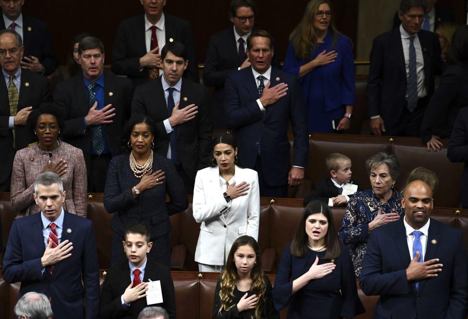 <p>Members of Congress take an oath during the start of the 116th Congressional swearing-in ceremony.</p>