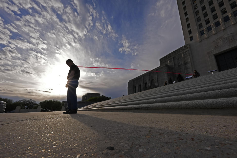 Jude Armstrong and fellow Benjamin Franklin High playwriting class students perform their play "The Capitol Project" on the steps of the Louisiana Capitol in Baton Rouge, La., Wednesday, March 27, 2024. (AP Photo/Gerald Herbert)