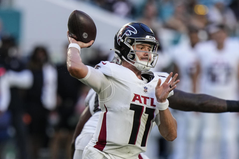Atlanta Falcons quarterback Logan Woodside (11) throws a pass during the first half of a preseason an NFL football game against the Miami Dolphins, Friday, Aug. 11, 2023, in Miami Gardens, Fla. (AP Photo/Wilfredo Lee)