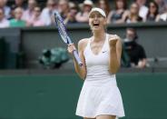 Maria Sharapova of Russia celebrates after winning her match against Coco Vandeweghe of the U.S.A. at the Wimbledon Tennis Championships in London, July 7, 2015. REUTERS/Stefan Wermuth