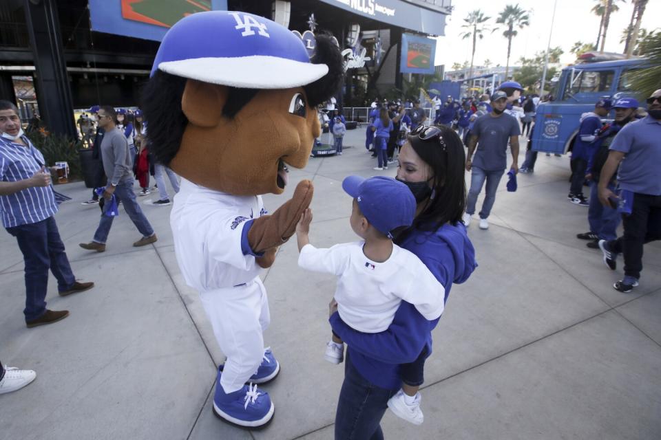 Dodgers bobblehead character greets fans.