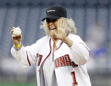 Food Network personality Paula Deen laughs before throwing out the first pitch prior to the Washington Nationals versus New York Mets MLB baseball game in Washington, in this May 19, 2010, file photo. REUTERS/Gary Cameron/Files