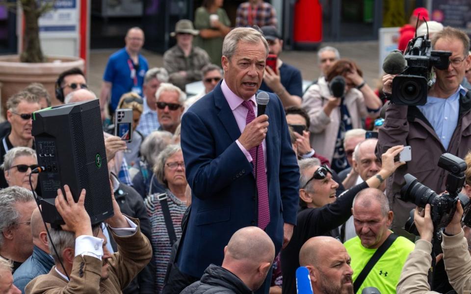 Reform UK party leader Nigel Farage launches his election candidacy at Clacton Pier on June 4