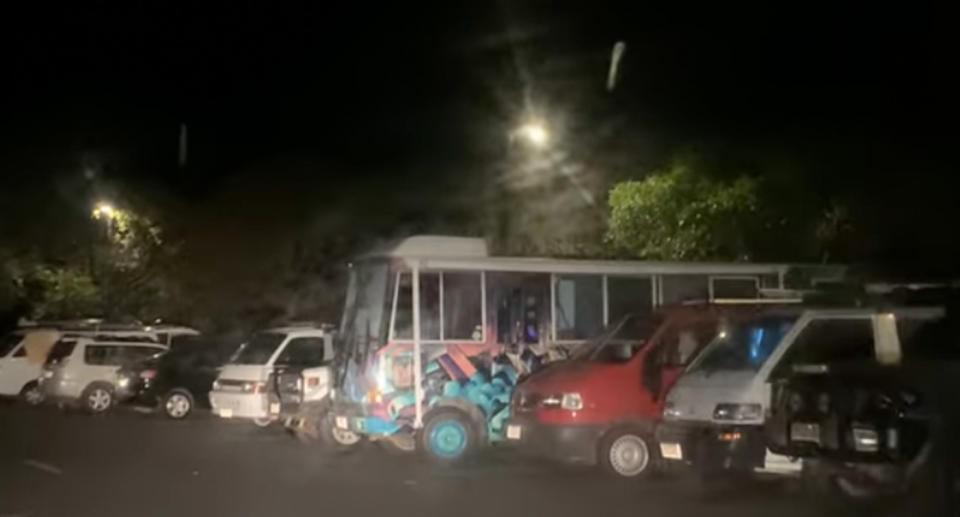 The Noosa car park is seen filled with vehicles late at night